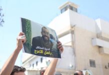 Israeli forces delay return of Basil al-Araj’s body as young Palestinians plan international protests